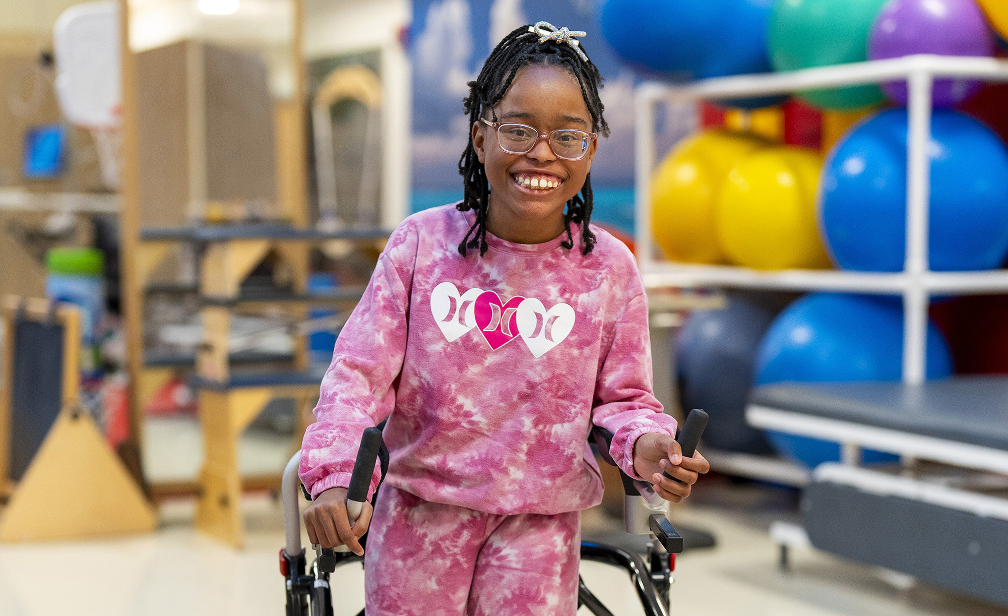 Medium shot of patient Sarah McDonald using a walker.