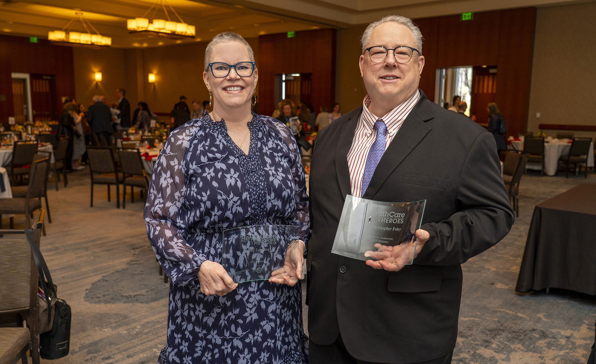 Molly Lowther, RN, and Dr. Christopher Foley with their awards.